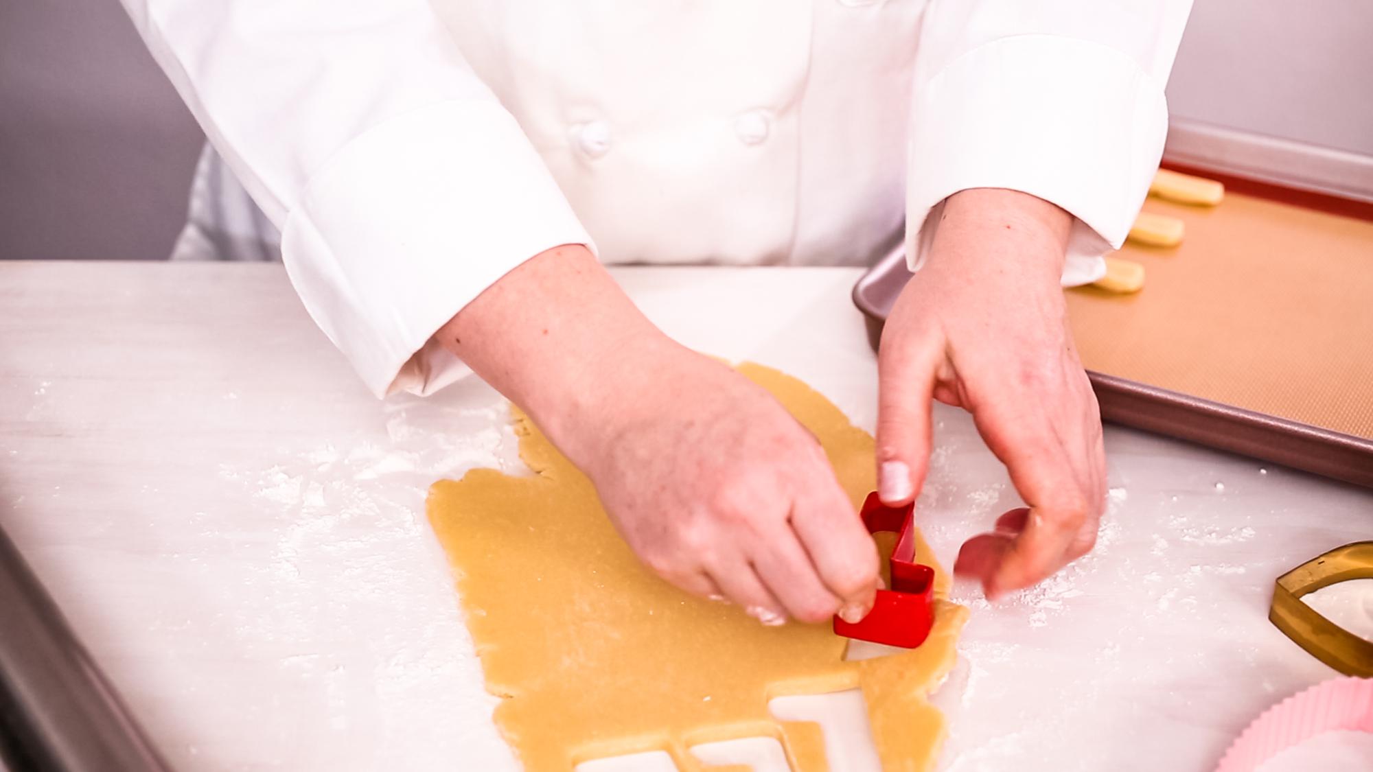 Student preparing pasta during online class